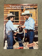 Load image into Gallery viewer, Vintage 1981 Wrangler - Wear What Cowboys Wear Advertisement Poster (21x28inch)
