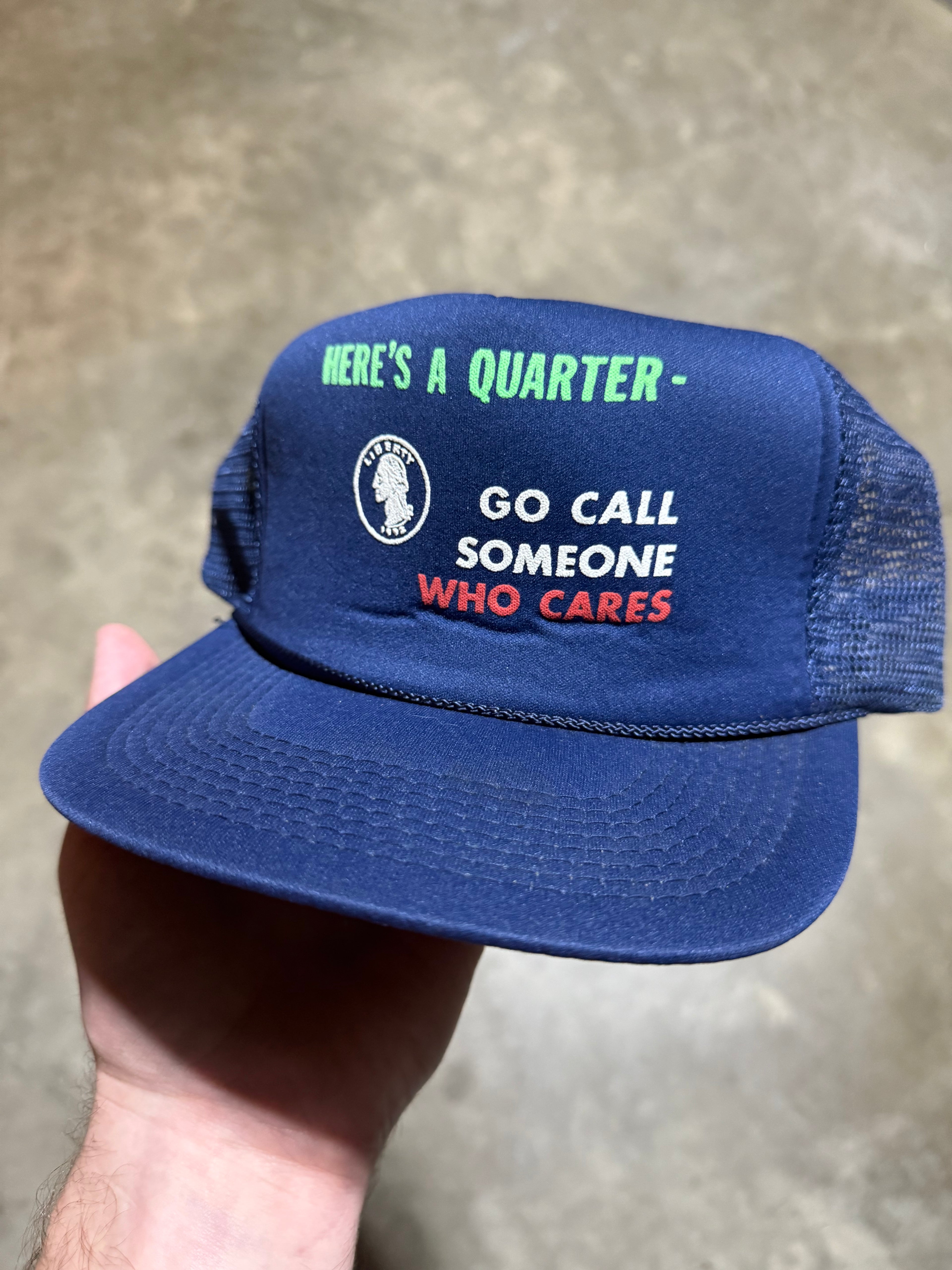 Vintage “Here’s A Quarter - Go Call Someone Who Cares” Trucker Hat